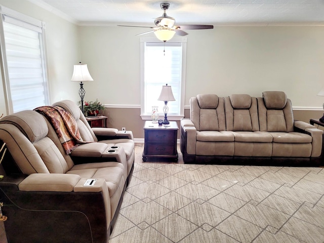 living room with ornamental molding and a ceiling fan