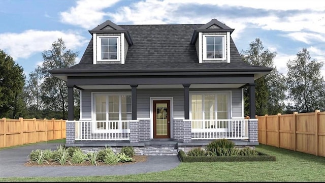 cape cod house featuring a porch, a front yard, and fence