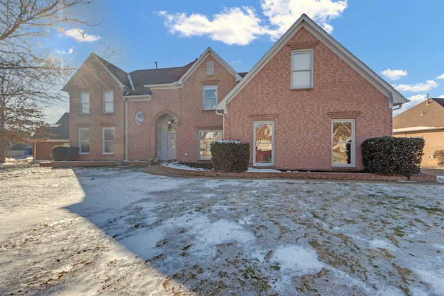 view of front facade featuring brick siding