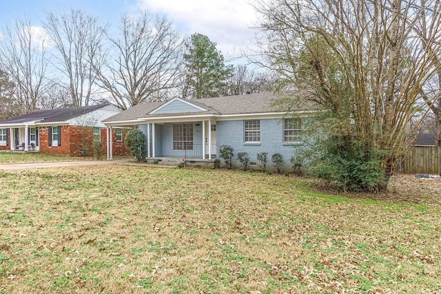 ranch-style house with a front yard, crawl space, and brick siding