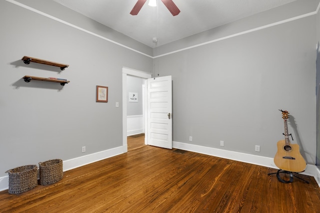 1151 Central Ave, Memphis, TN 38104 - unfurnished bedroom with ceiling fan, baseboards, and wood finished floors