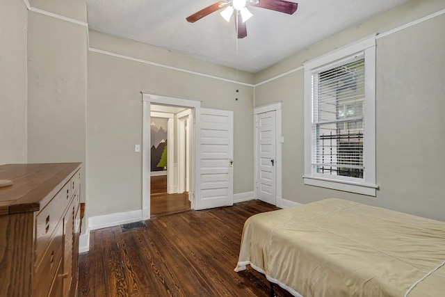 1151 Central Ave, Memphis, TN 38104 - bedroom featuring dark wood finished floors, baseboards, and ceiling fan