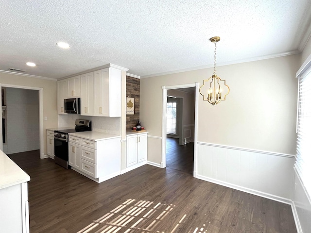 kitchen with dark wood-style floors, hanging light fixtures, stainless steel appliances, light countertops, and white cabinetry