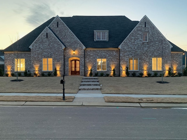 view of front of property featuring brick siding