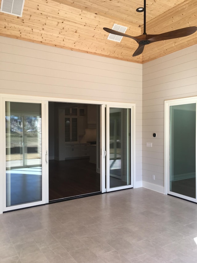 view of patio featuring ceiling fan and visible vents