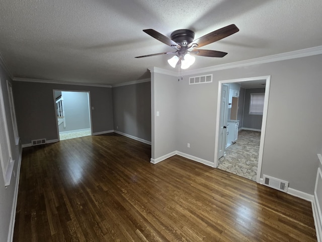 unfurnished room with visible vents and dark wood finished floors