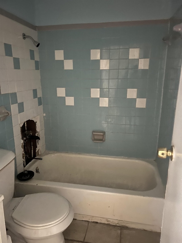 full bath with toilet, tile patterned flooring, and bathtub / shower combination