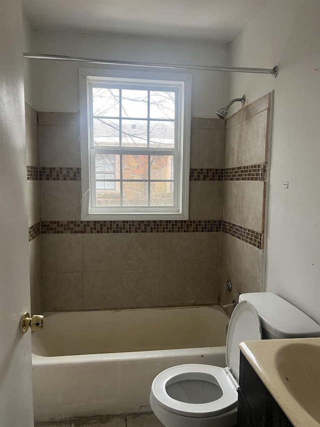 full bathroom featuring  shower combination, vanity, and toilet