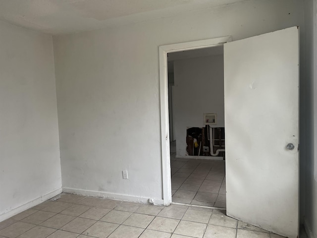 unfurnished room with light tile patterned floors