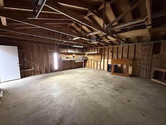 misc room featuring a garage and concrete floors