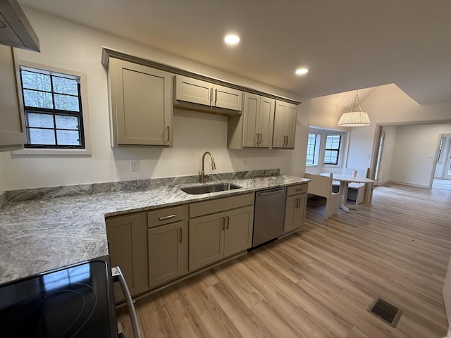 kitchen featuring electric range oven, a sink, visible vents, dishwasher, and pendant lighting