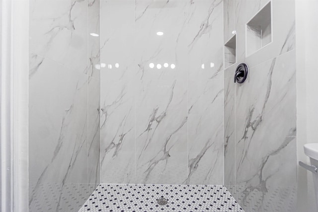 full bathroom featuring a marble finish shower