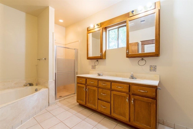 full bathroom featuring a garden tub, tile patterned flooring, a sink, a shower stall, and double vanity