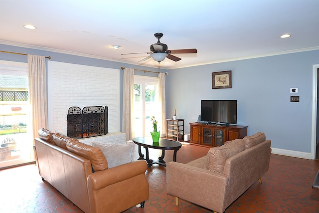 living area with recessed lighting, a ceiling fan, baseboards, ornamental molding, and a brick fireplace