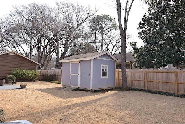 view of shed with a fenced backyard