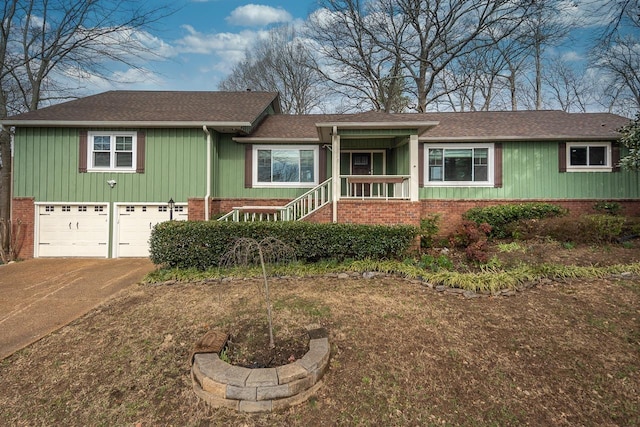 ranch-style house with a garage, concrete driveway, and brick siding