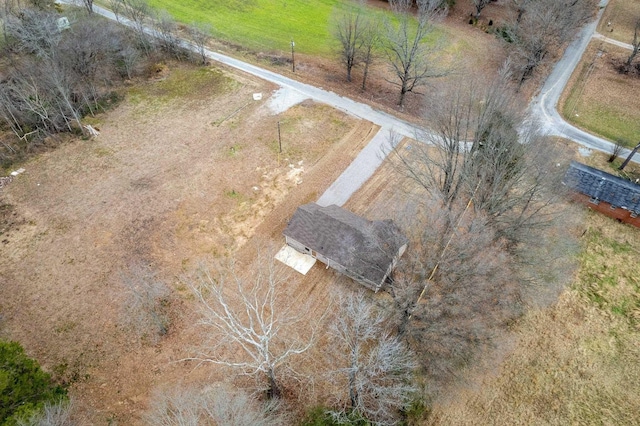 birds eye view of property with a rural view