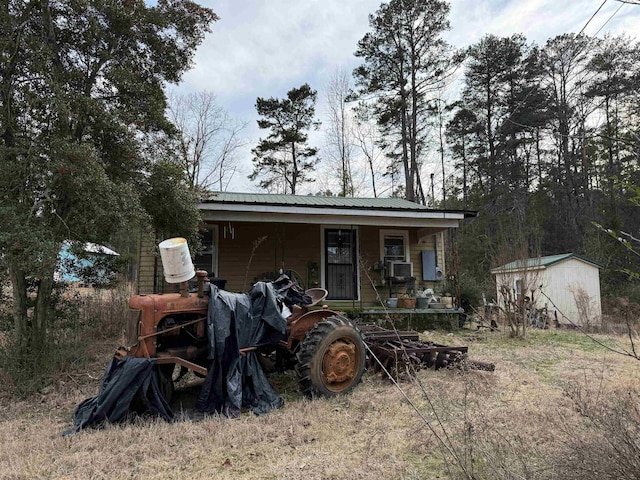 view of shed with covered porch