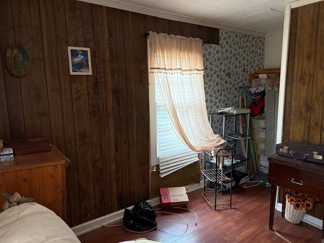 bedroom featuring multiple windows and wood finished floors