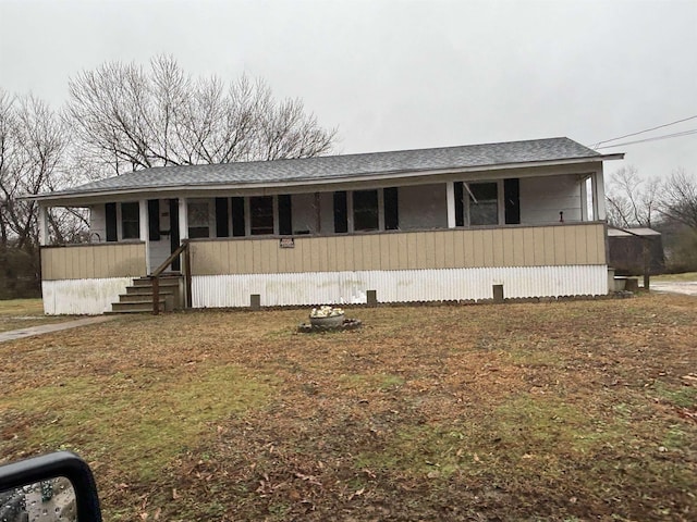 manufactured / mobile home with roof with shingles