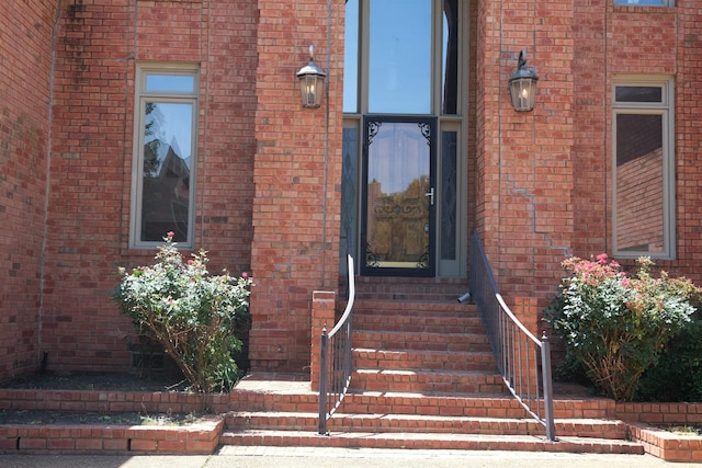 property entrance with brick siding