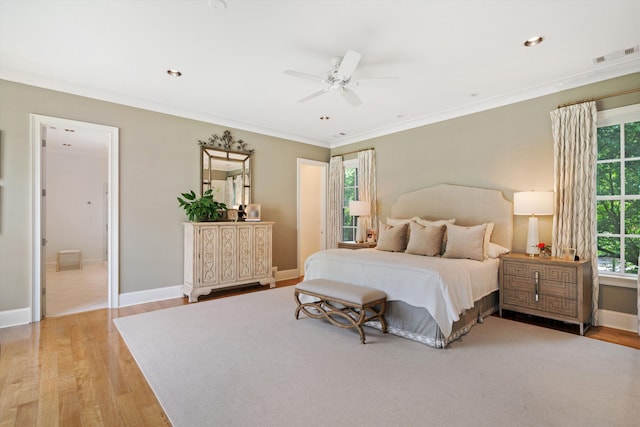 bedroom featuring visible vents, baseboards, light wood-style flooring, ornamental molding, and recessed lighting