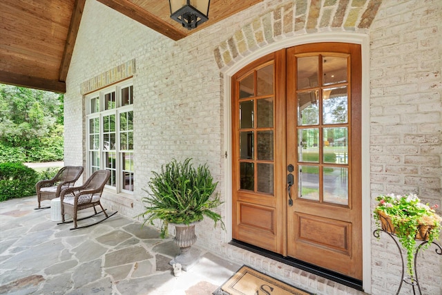 property entrance with brick siding