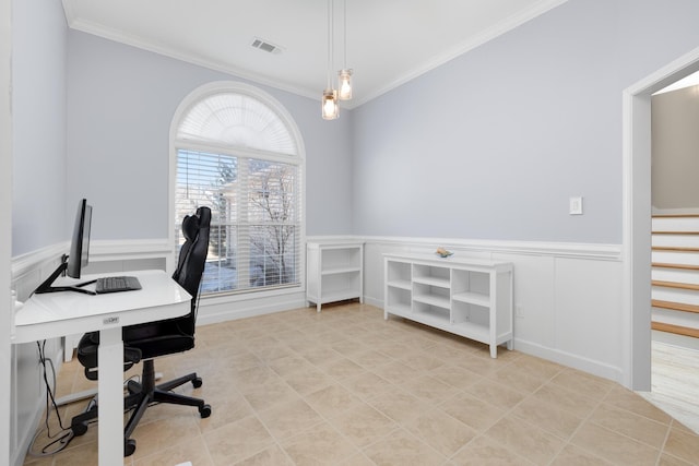 home office featuring a decorative wall, visible vents, ornamental molding, and wainscoting