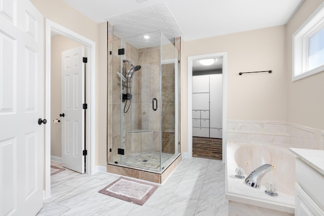 bathroom featuring a shower stall and a whirlpool tub