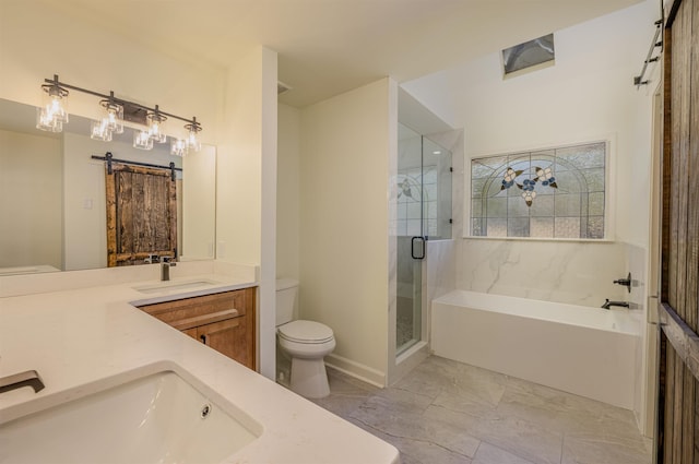 bathroom with double vanity, a sink, toilet, and a shower stall