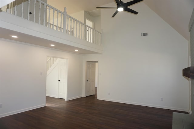 unfurnished living room with baseboards, a ceiling fan, and wood finished floors