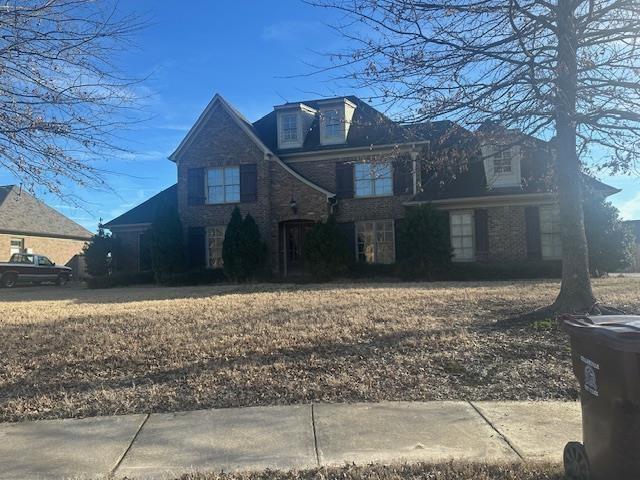 view of front of property with brick siding