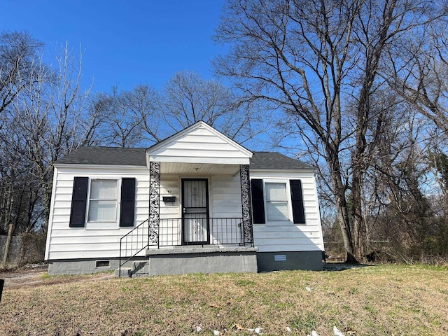 bungalow-style house with roof with shingles, a front lawn, crawl space, and a porch