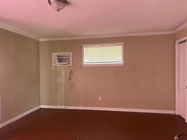 unfurnished room featuring a textured ceiling, baseboards, a wall unit AC, and crown molding