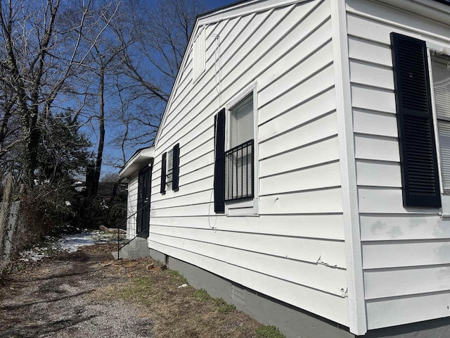 view of side of home with crawl space