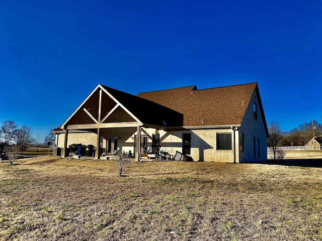 rear view of house with stucco siding