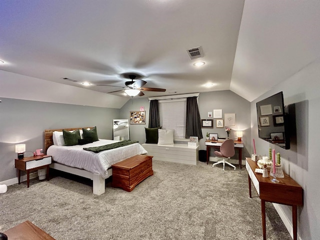 bedroom featuring vaulted ceiling, carpet flooring, and visible vents