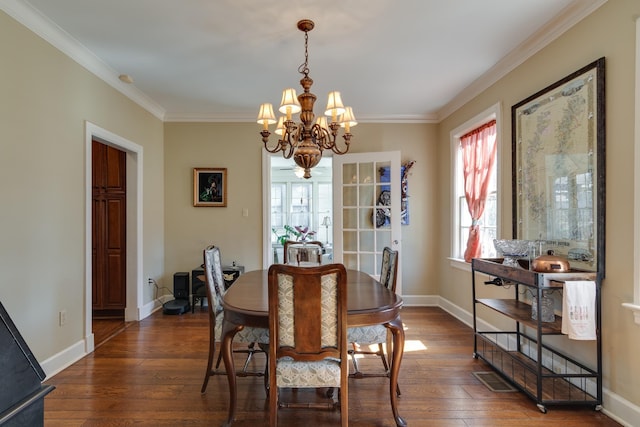 dining area with crown molding, dark wood-style flooring, and baseboards