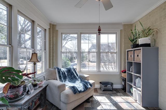 sunroom featuring plenty of natural light and ceiling fan