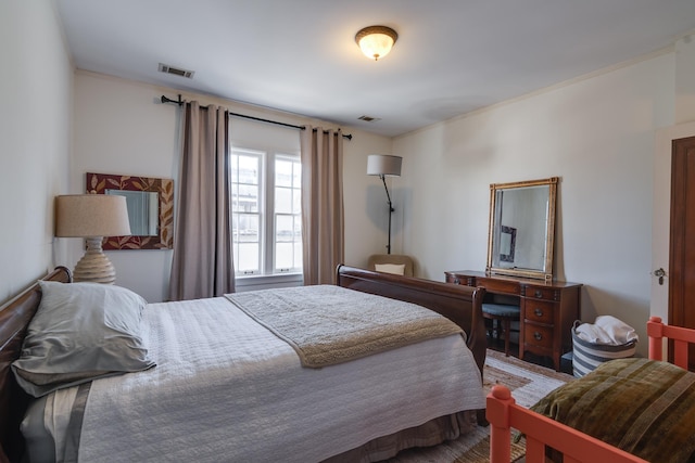 bedroom featuring visible vents