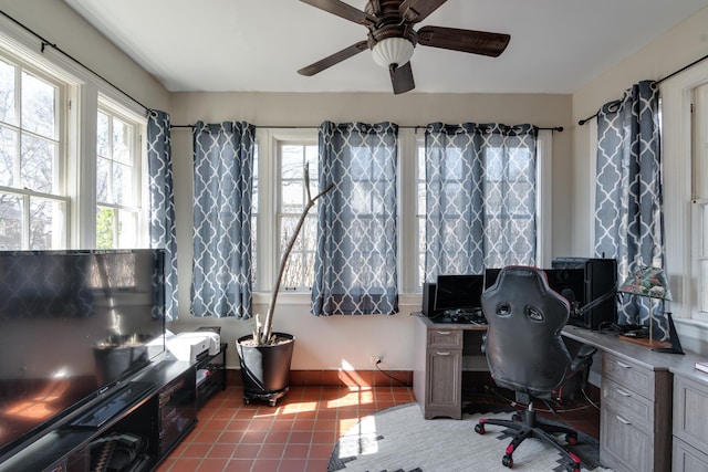 office space with a healthy amount of sunlight, ceiling fan, and light tile patterned floors