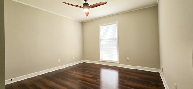 unfurnished room with ceiling fan, ornamental molding, dark wood-style flooring, and baseboards