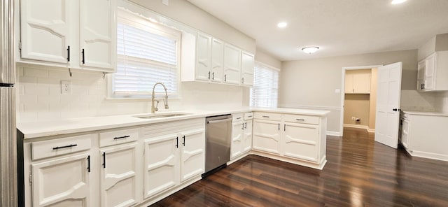 kitchen with dishwasher, dark wood-style floors, light countertops, white cabinetry, and a sink