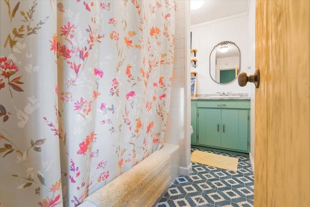 full bath with ornamental molding, vanity, and shower / tub combo with curtain