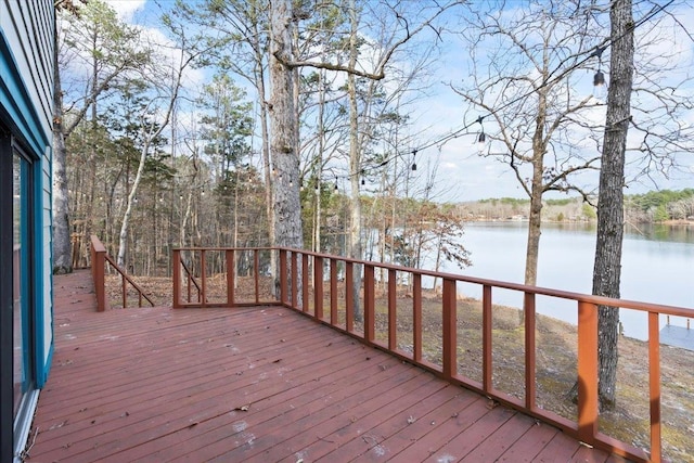 wooden terrace featuring a water view