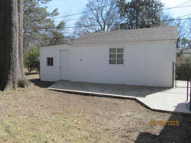 view of outdoor structure with fence