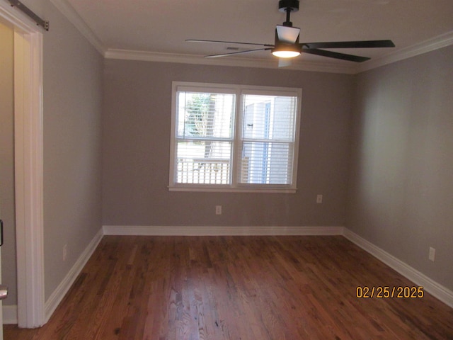 empty room featuring ornamental molding, dark wood-type flooring, baseboards, and a ceiling fan