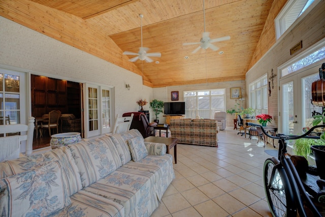 living room featuring wooden ceiling, light tile patterned floors, high vaulted ceiling, and french doors