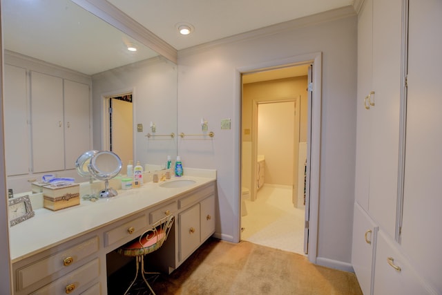 full bathroom featuring toilet, baseboards, crown molding, and vanity