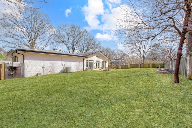 view of yard with cooling unit and a fenced backyard